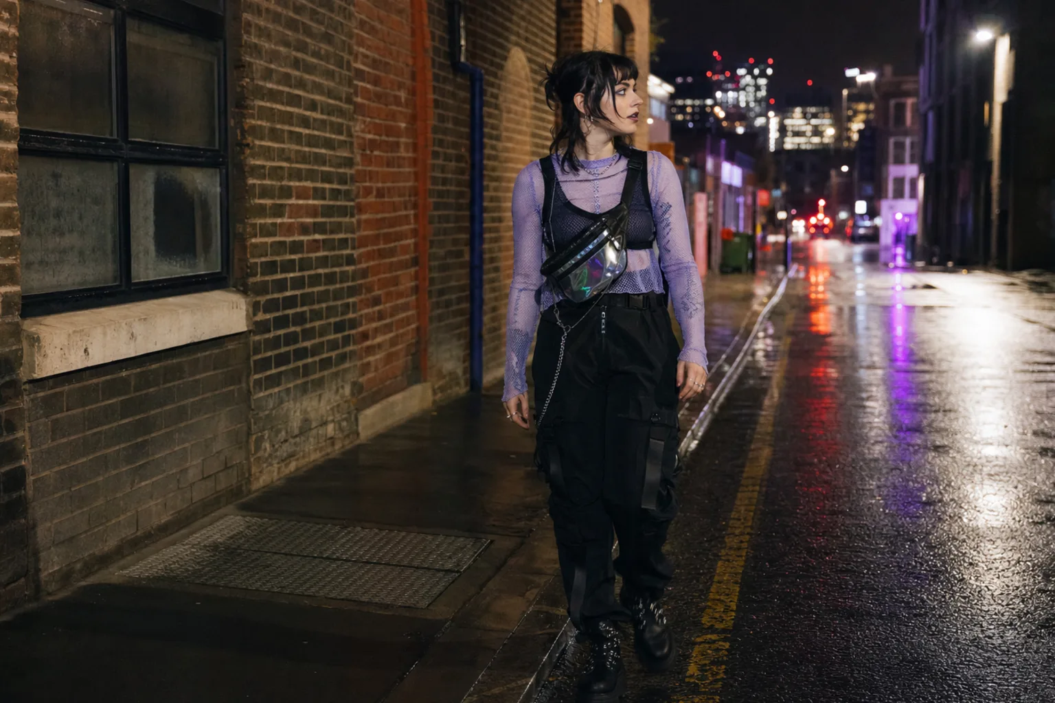 Realistic editorial lifestyle scene illustrating cyberpunk fashion: a functional approach to the futuristic look